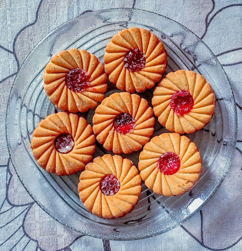 A plate of cookies with sweet pepper jelly filling