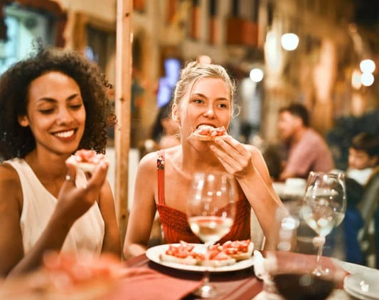 Woman Eating At Restaurant