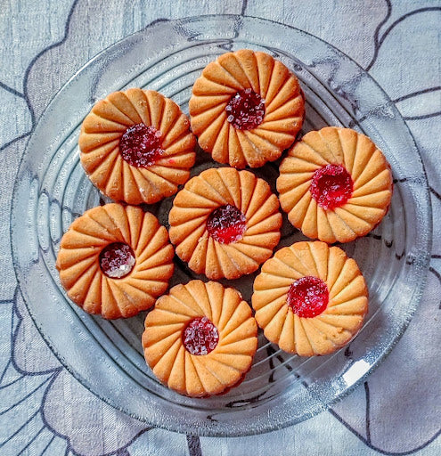 A plate of cookies with sweet pepper jelly filling