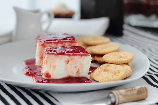 Cream cheese dessert topped with pepper jelly