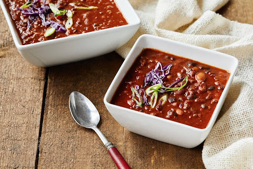 Two bowls of sweet and spicy chili made with pepper jelly
